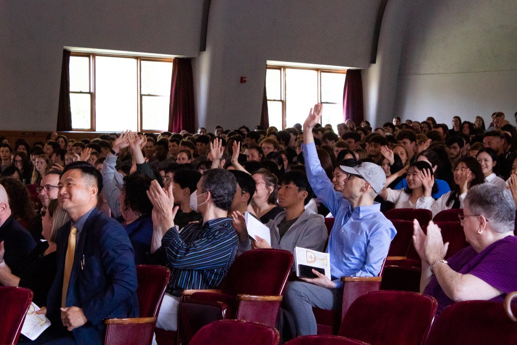 Audience members clapping