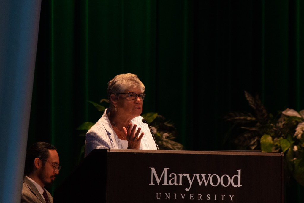 Woman talking at a podium