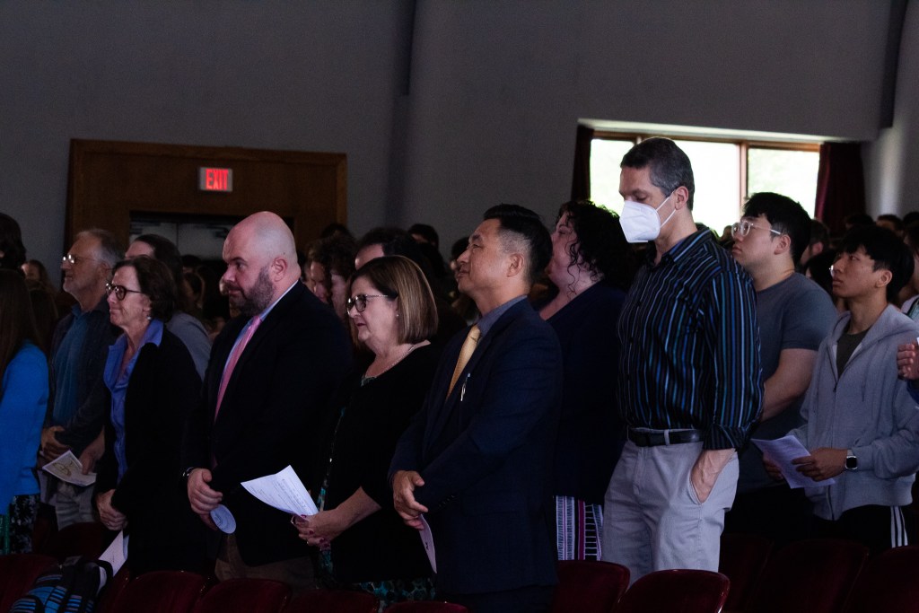 Audience members standing