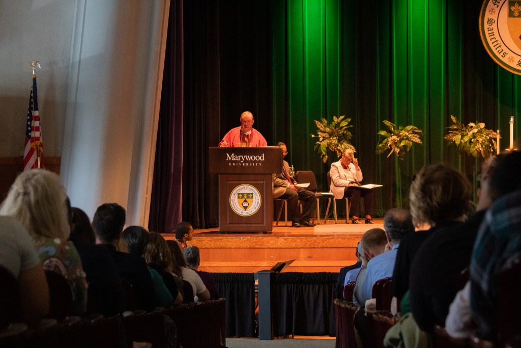 Man talking at a podium
