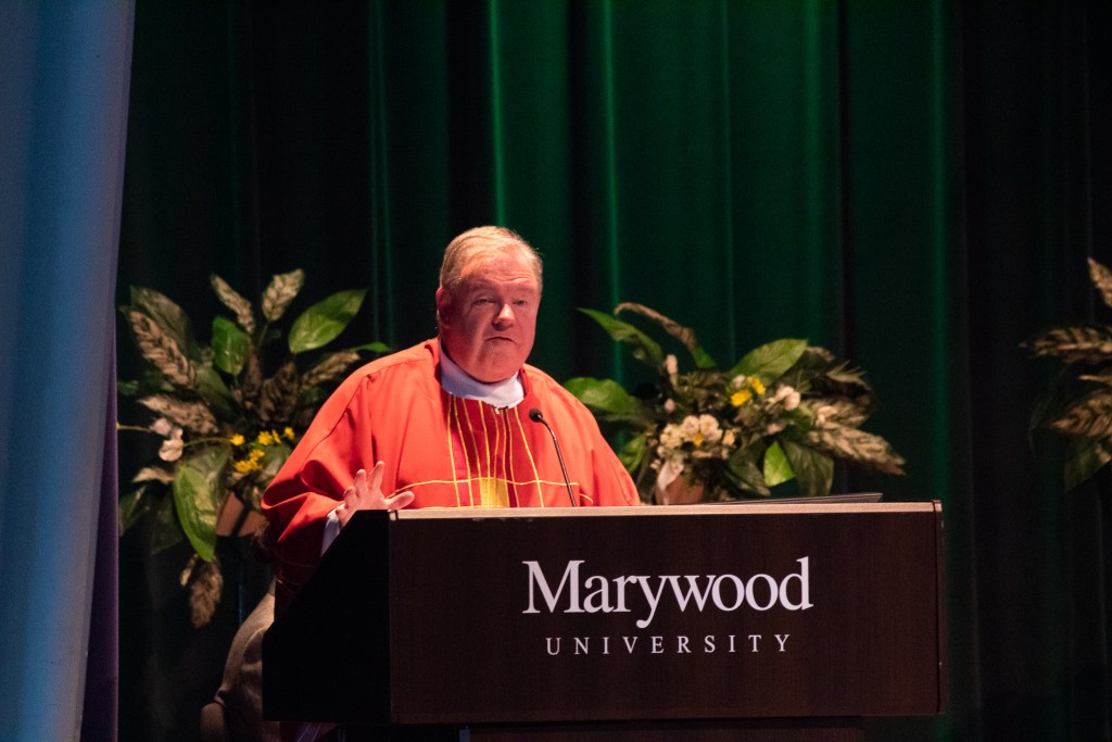 Man talking at a podium