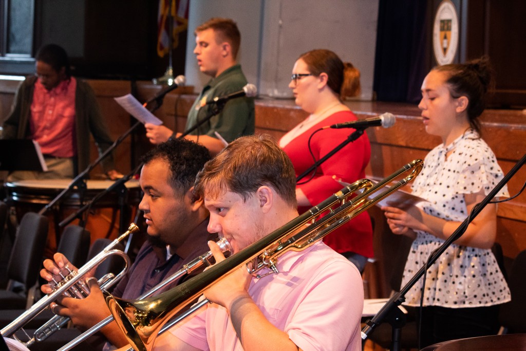 Students playing instruments and singing