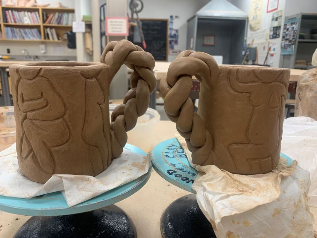 2 ceramic mugs with a braided handle
