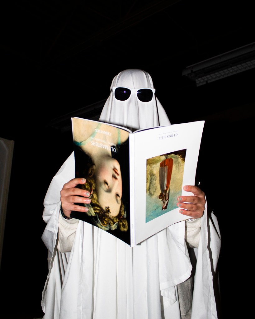 Ghost man reading a upside down magazine 