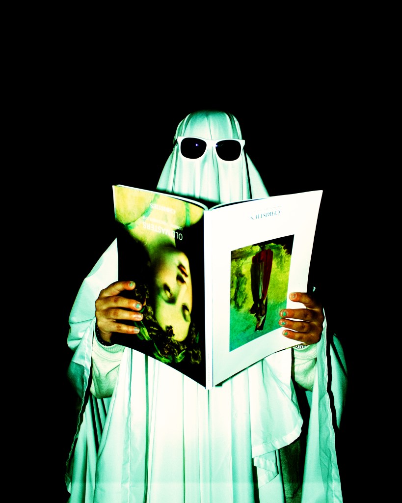 Ghost man reading a upside down magazine 