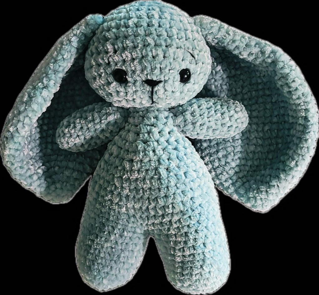 My blue stuffed rabbit I made, with some unskilled embroidery work.