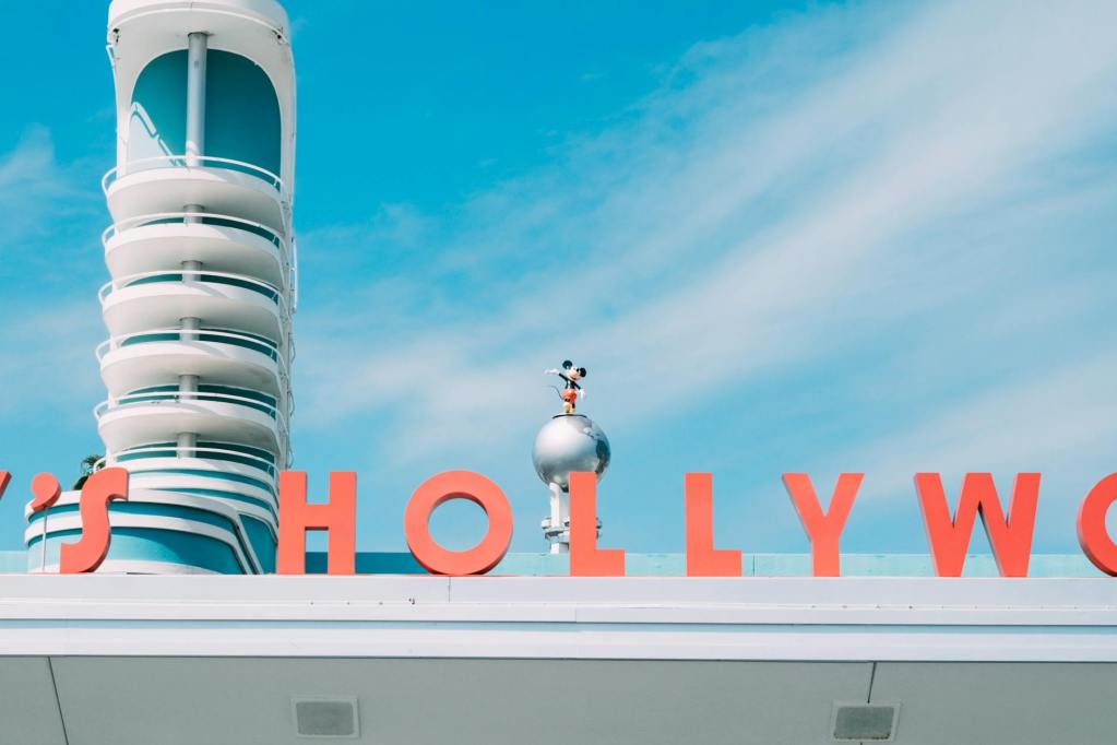 mickey mouse figure over disneys hollywood studios sign