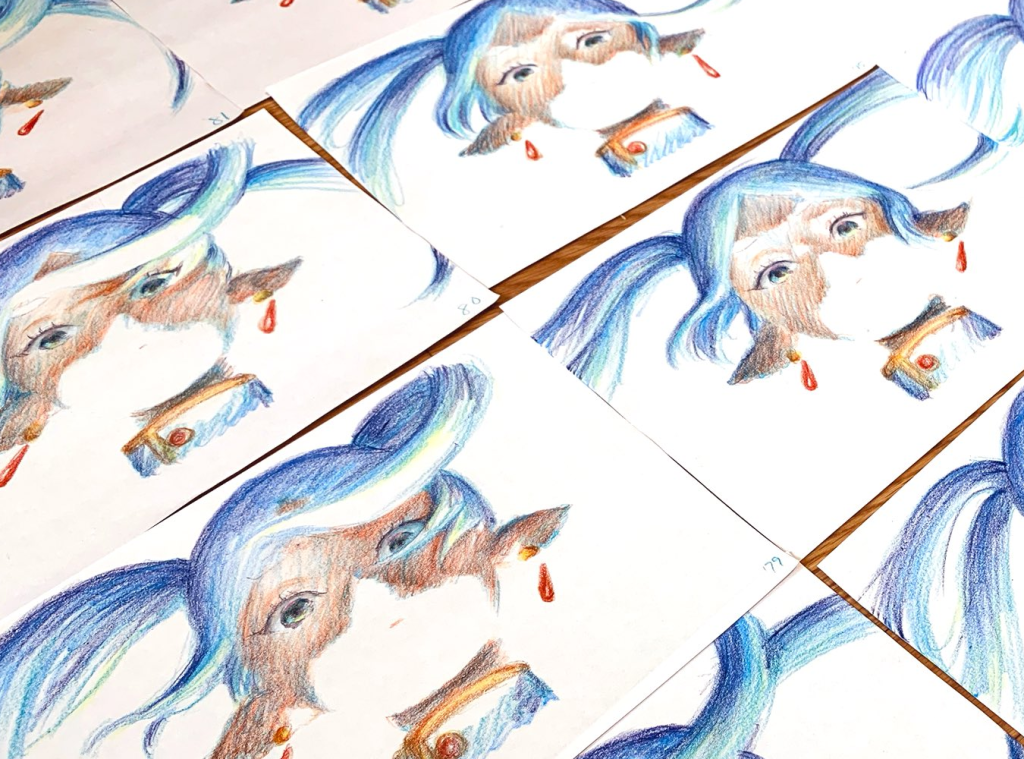 work in progress drawings of the character Frieren done in colored pencil