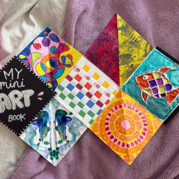 Image of mini art book half open.